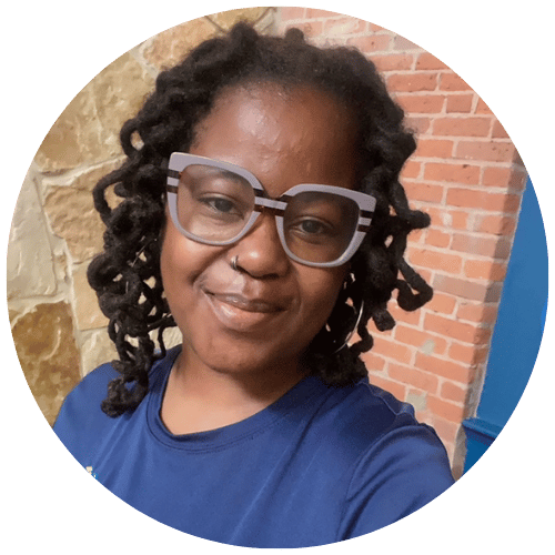 Eboni Dinkins a smiling massage therapist